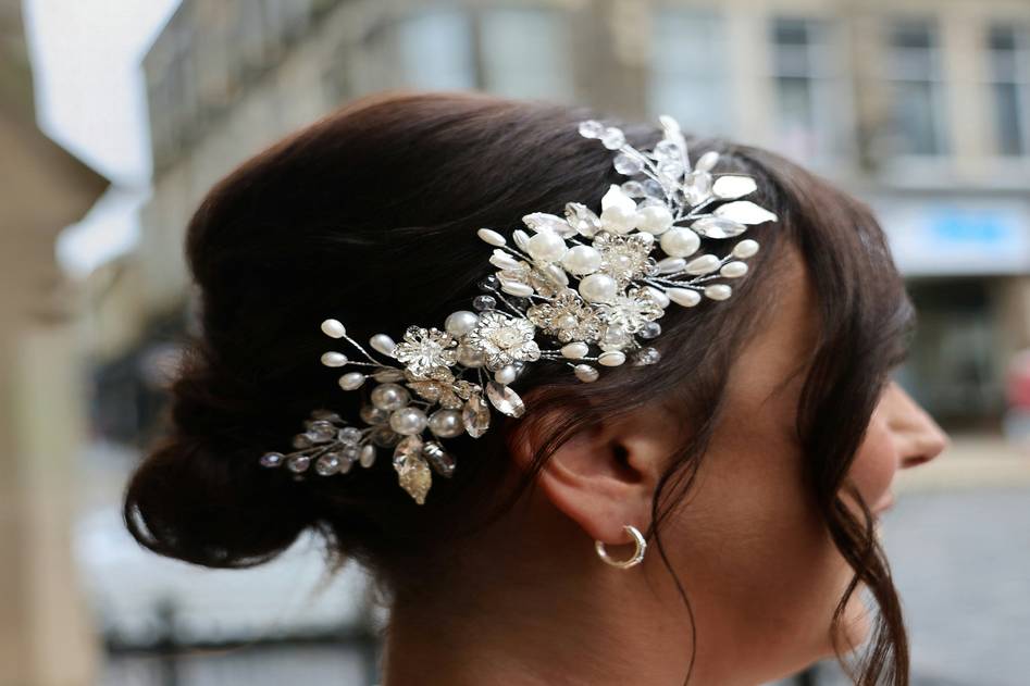 Collection of vintage and modern hair barrettes on neutral linen fabric