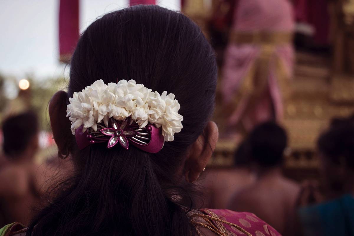 Woman using hair barrettes for Everyday Use styling at home