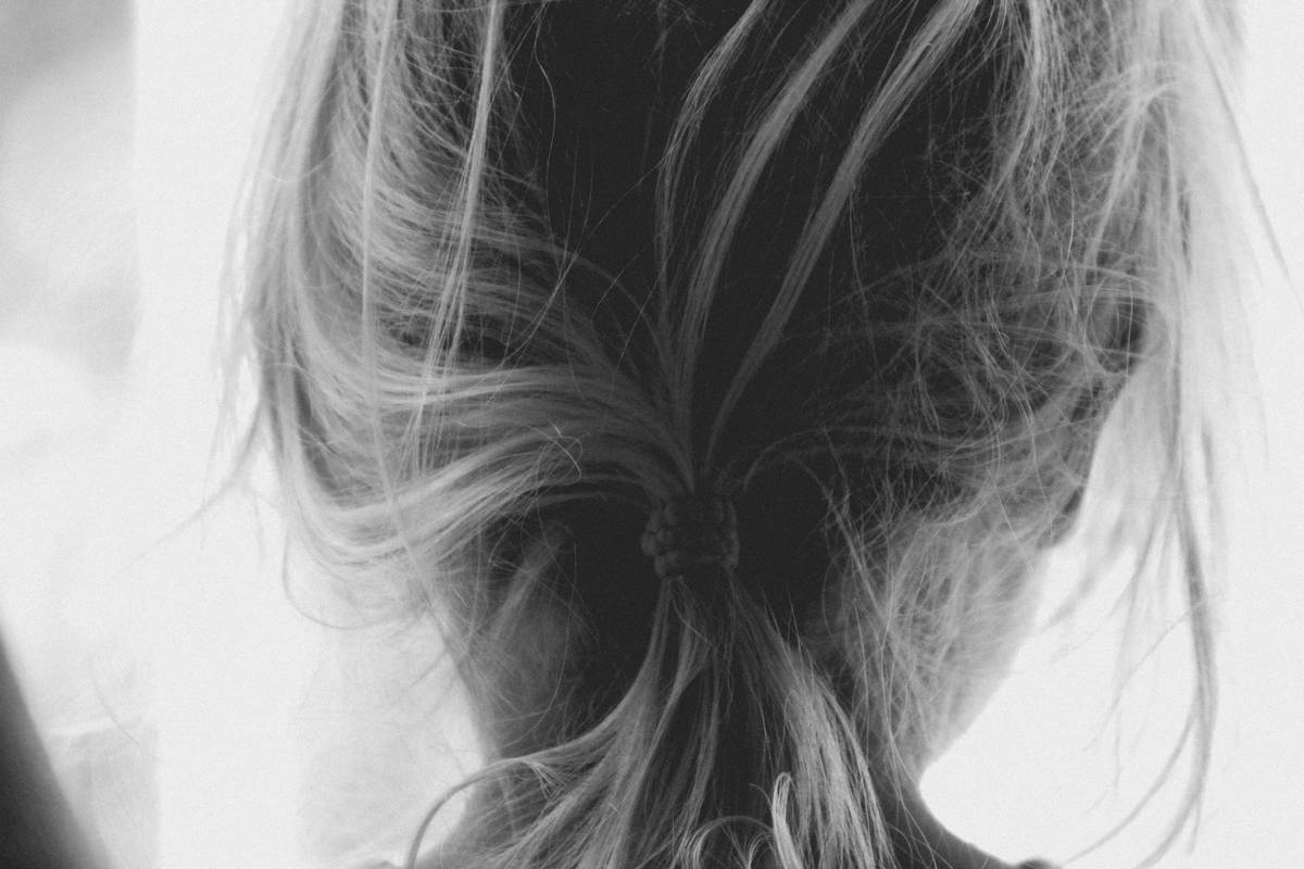 Woman demonstrating simple hair looks with barrettes at tension zone